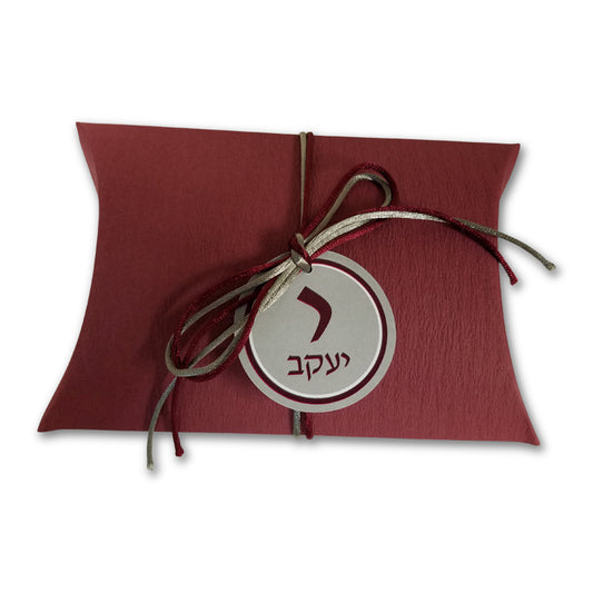 Burgundy pillow box with cord and tag